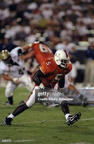 Edgerrin James of the Miami Hurricanes runs with the ball during a game against the East Tennessee State Buccaneers at the Orange Bowl in Miami,...