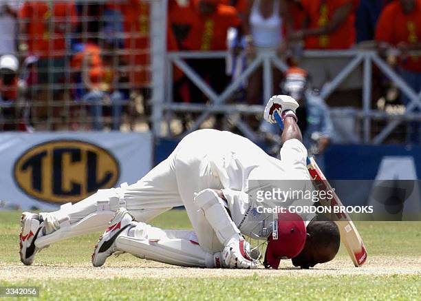 West Indies captain Brian Lara kisses the ground in celebration of his record breaking 385 on the third day of the fourth and final C&W test vs...