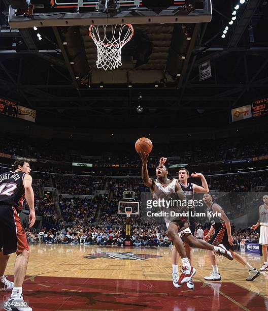 Dajuan Wagner of the Cleveland Cavaliers shoots a layup during the game against the Utah Jazz at Gund Arena on March 19, 2004 in Cleveland, Ohio. The...