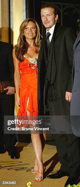 Real Madrid soccer player David Beckham and his wife, Victoria Beckham, leave Claridges Hotel April 12, 2004 in London, England.