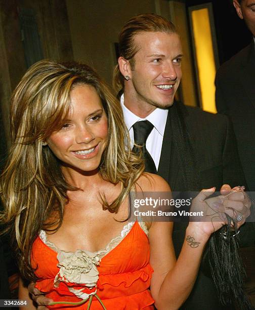 Real Madrid soccer player David Beckham and his wife, Victoria Beckham, leave Claridges Hotel April 12, 2004 in London, England.