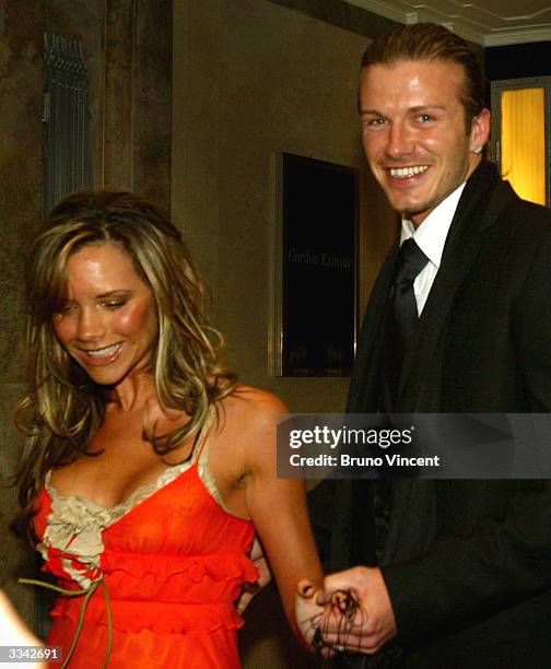 Real Madrid soccer player David Beckham and his wife, Victoria Beckham, leave Claridges Hotel April 12, 2004 in London, England.