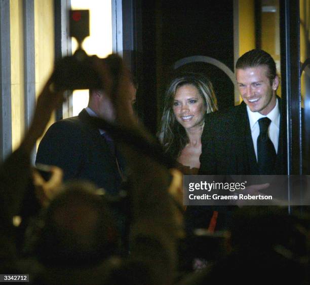 Real Madrid soccer player David Beckham and his wife, Victoria Beckham, meet the media as they leave Claridges Hotel April 12, 2004 in London,...