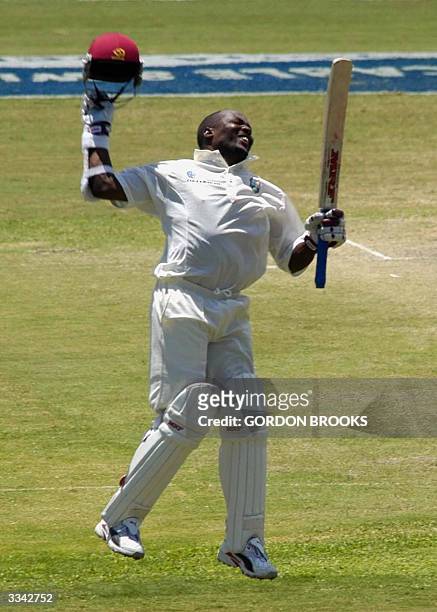West Indies captain Brian Lara jumps in celebration of breaking the world record of 380 runs on the third day of the fourth and final C&W Test...