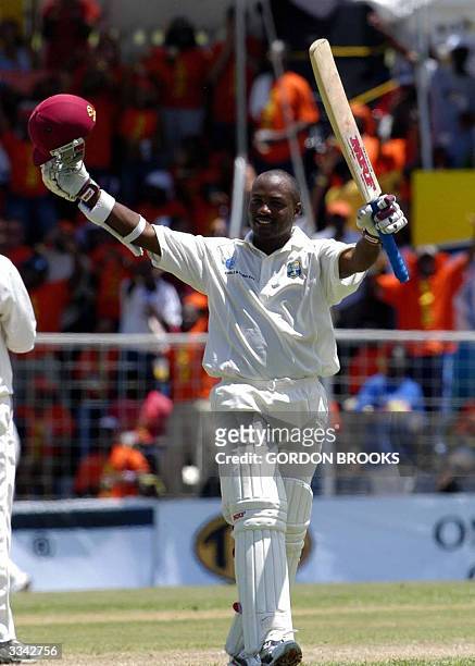 West Indies captain Brian Lara celebrates breaking the world record of 380 runs on the third day of the fourth and final C&W Test against england...