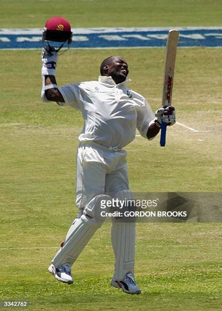 West Indies captain Brian Lara jumps in celebration of breaking the world record of 380 runs on the third day of the fourth and final C&W Test...
