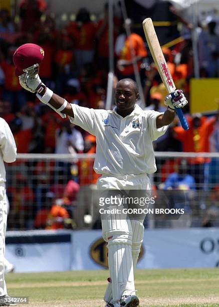 West Indies captain Brian Lara celebrates breaking the world record of 380 runs on the third day of the fourth and final C&W Test against England 12...