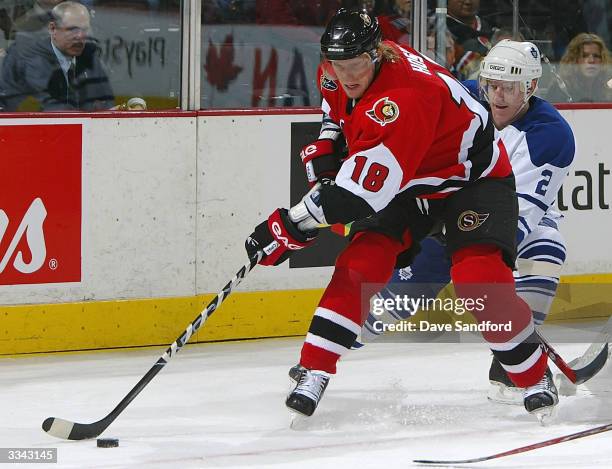 Brian Leetch of the Toronto Maple Leafs chases after Marian Hossa of the Ottawa Senators during game three of the Eastern Conference Quarter-Finals...