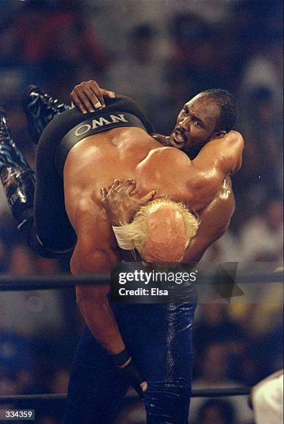 Karl Malone takes on Hollywood Hogan during the WCW Bash at the Beach at the Cox Arena in San Diego, California. Mandatory Credit: Elsa Hasch...