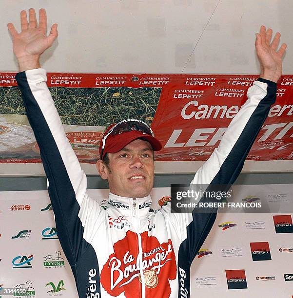 French cyclist Franck Bouyer waves on the podium after he won the Paris-Camembert cycling race, 13 April 2004 in Vimoutiers, northwestern France. AFP...