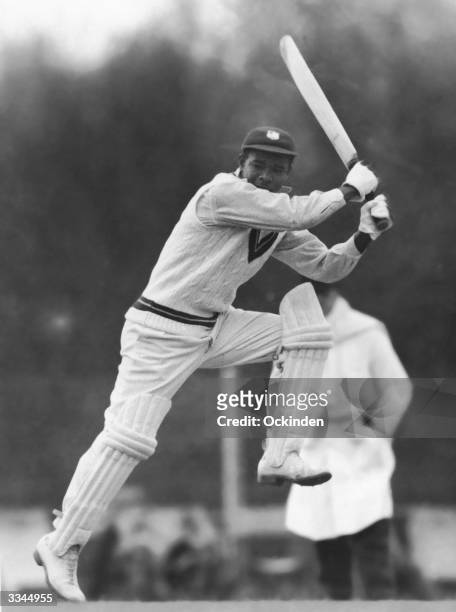 West Indies cricketer Everton Weekes batting energetically at Kingston against a Club Cricket Conference team, 28th April 1950.