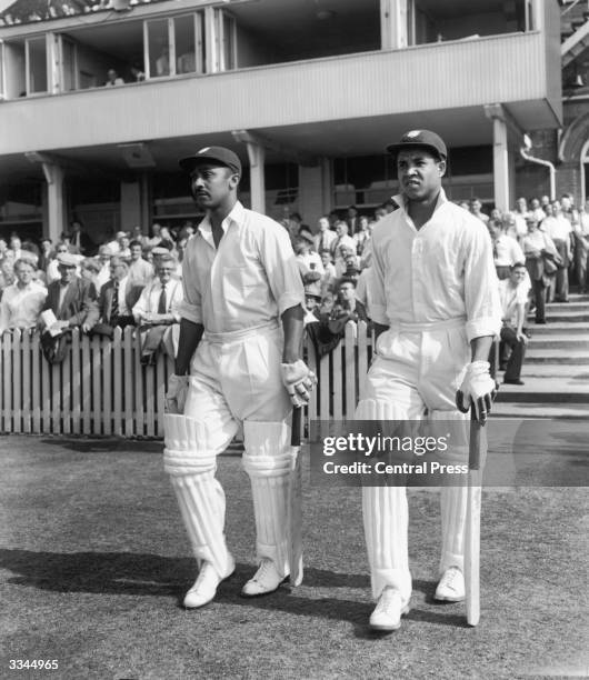 Frank Worrell, left, and Garfield Sobers coming out to bat during the Third England vs West Indies Test at Trent Bridge, Nottingham, July 1957.