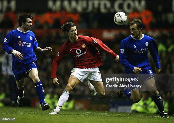 Cristiano Ronaldo of Manchester United beats Keith Gillespie and Riccardo Scimeca of Leicester City during the FA Barclaycard Premiership match...