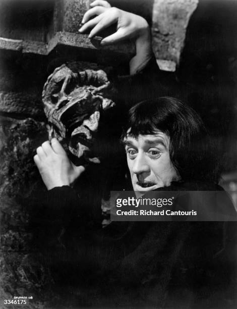 Irish actor Cyril Cusack plays the French revolutionary Chauvelin in the film 'The Elusive Pimpernel'. In this scene he clings desperately to a...