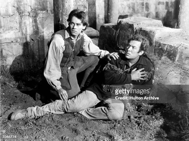 American actors Henry Fonda and Ward Bond in a scene from the 20th Century Fox production 'Drums Along The Mohawk'.
