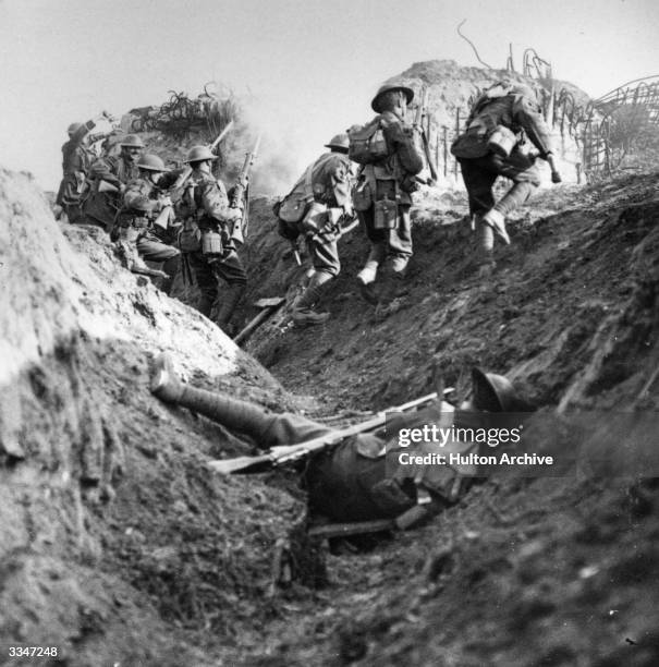 British soldiers in the trenches during World War I. Original Publication: From 'Official Series The Great War' - 'With dogged courage we overcome...