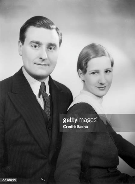 Composer Walter Leigh, whose work 'Jolly Roger', a musical burlesque is playing at the Savoy theatre in London, with his fiancee Marion Blandford.
