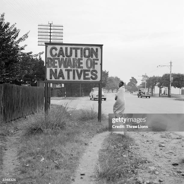 Sign common in Johannesburg, South Africa, reading 'Caution Beware Of Natives'.