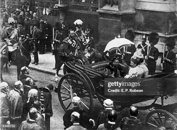 Queen Victoria in an open carriage passing the Law Courts at the City boundary on the way to St Paul's. Her son Albert Edward, the Prince of Wales is...
