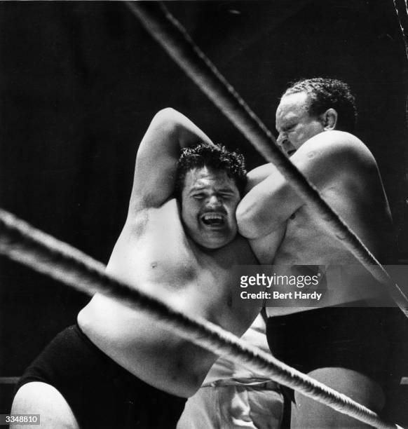 Two wrestlers, Hussey and Knight, getting to grips with each other during an International Free-Style Wrestling Concert at Belle Vue, Manchester. The...