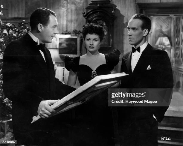 Dramatic moment for British actors Margaret Lockwood , Ian Hunter , and Barry K Barnes in the John Corfield production of 'Bedelia', when Ben gives...