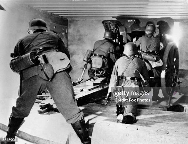 Part of Germany's Rhine fortifications consist of pill boxes large enough to hold a field gun and crew. An artillery battle is raging along the Rhine...