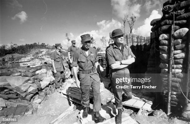 Lt Col Colin 'Mad' Mitchell with fellow soldiers during the Vietnam War.