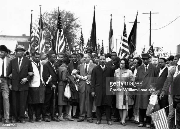 Civil rights campaigner Dr Martin Luther King with his wife Coretta Scott King , at a black voting rights march from Selma, Alabama, to the state...