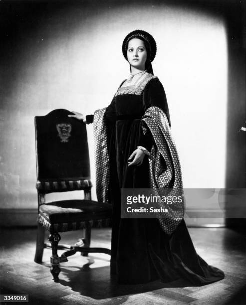 English actress, Merle Oberon in costume as Anne Boleyn for Alexandra Korda's film production, 'The Private Life of Henry VIII'