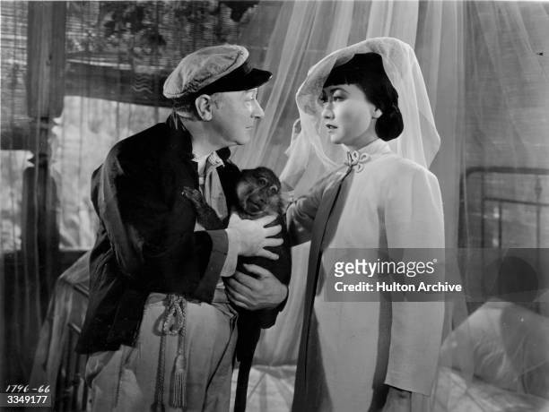 Eric Blore and Anna May Wong in a scene from Paramont's 'Island Of Lost Men'.