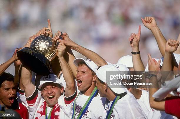 Peter Nowak and Jesse Marsch of the Chicago Fire celebrate with teammates following the MLS Cup Game against the DC United at the Rose Bowl in...