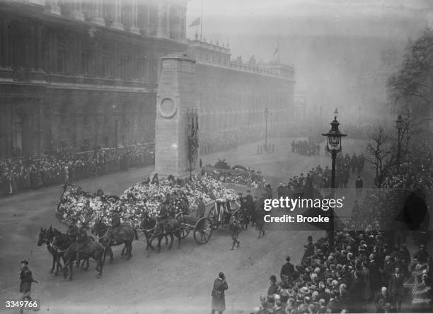 The funeral of British officers killed in Ireland passes the Cenotaph in London.