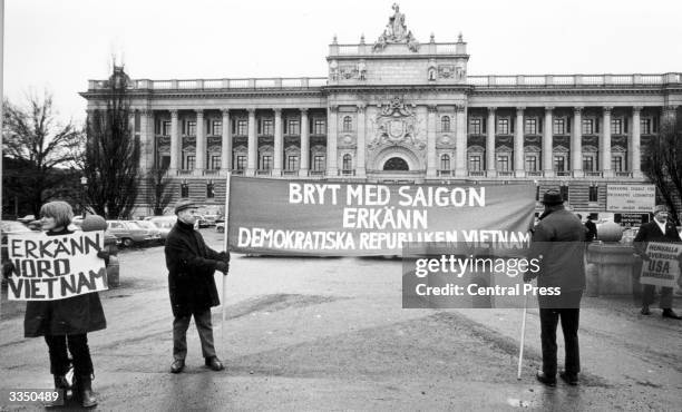 Protestors outside Sweden's Riksdag building holding a banner demanding recognition of the Democratic Republic of Vietnam during a debate on foreign...