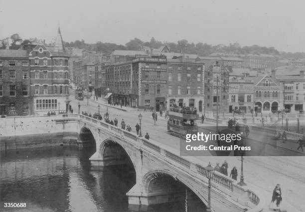 Tram crosses the bridge in Cork City, Ireland.