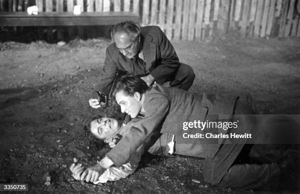 Light meter is checked before filming a fight scene between Emlyn Williams and Richard Burton on the set of 'Last Days Of Dolwyn', about a Welsh...