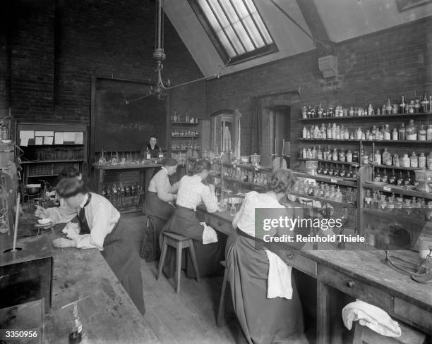 Female undergraduates at work in the laboratory at Girton College, Cambridge University. The college, founded in 1869, was the first for female...