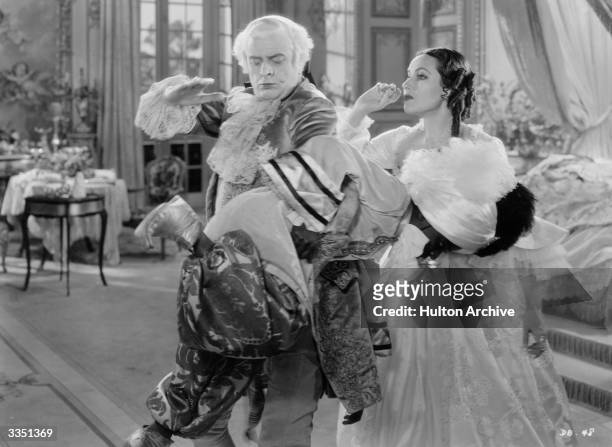 Mexican actress Dolores del R o as Madame DuBarry watching Reginald Owen spank a wayward black domestic in William Dieterle's remake of 'Madame...