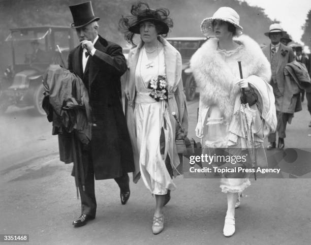 Visitors to Ascot race course, Berkshire, dressed in their best.