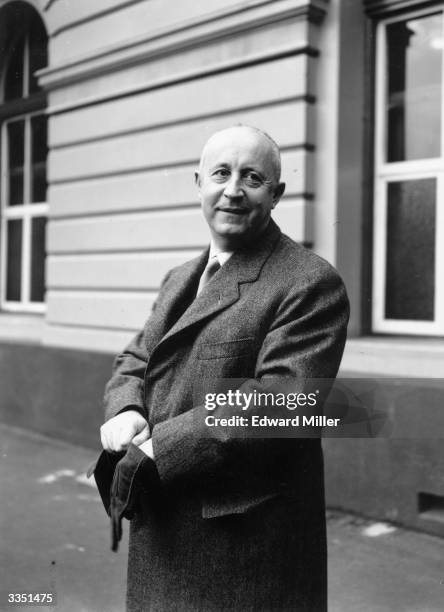 French fashion designer Christian Dior arrives from Paris at Victoria, London, to attend his fashion parade, which is being held at Blenheim Palace...