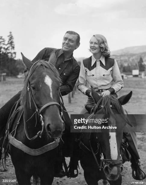 American actor Clark Gable out riding in Colorado with his wife Sylvia Ashley during location shooting of the MGM film 'Across the Wide Missouri'.