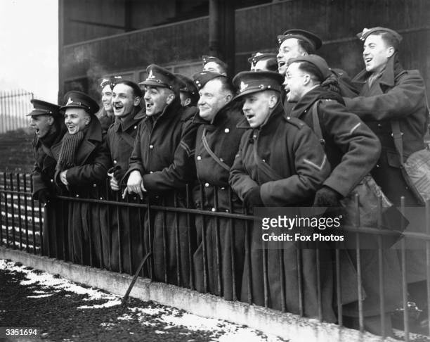 Army supporters watching a football match between England and the Army at Selhurst Park in London.