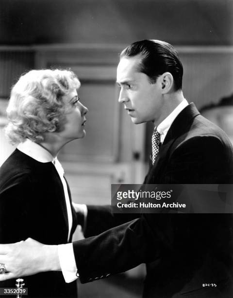 Franchot Tone and Una Merkel in a scene from the film 'One New York Night' , directed by Jack Conway for MGM.