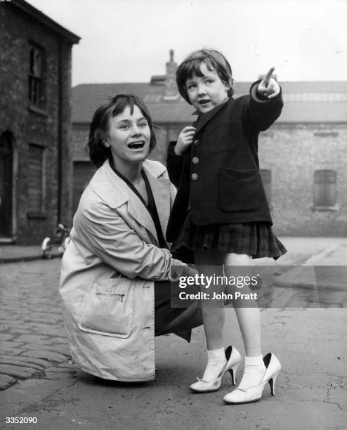 Actress Rita Tushingham gets to know Elaine Yates, a young resident of Salford in Greater Manchester, to prepare for her part in 'A Taste of Honey',...