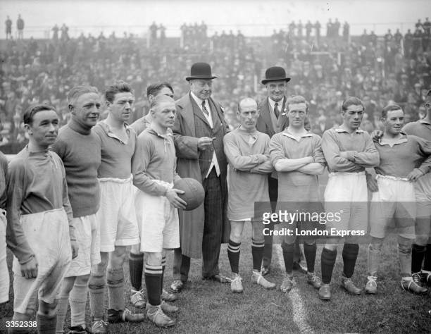 English sportsman Hugh Cecil Lowther, 5th Earl of Lonsdale, with some of the jockeys playing in the North v South Country charity football match at...