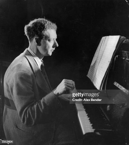 Benjamin Britten, Baron Britten of Aldeburgh playing the piano. Original Publication: Picture Post - 1924 - The Birth Of A New Opera - pub. 1945