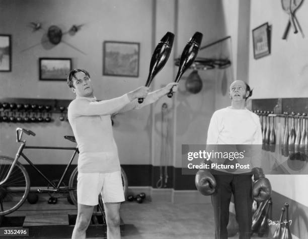 Actors Edmund Lowe and Lucien Littlefield in the film 'The Reason Why'.