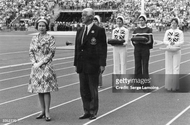 Queen Elizabeth II prepares to present the medals to the winners at the Commonwealth Games in Christchurch, New Zealand.