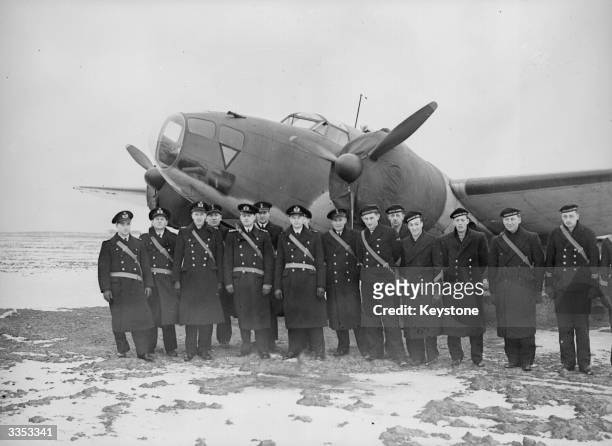 Men of the Royal Dutch Naval Air Service in front of one of the American built Hudsons financed by Queen Wilhelmina. They will fly with the British...