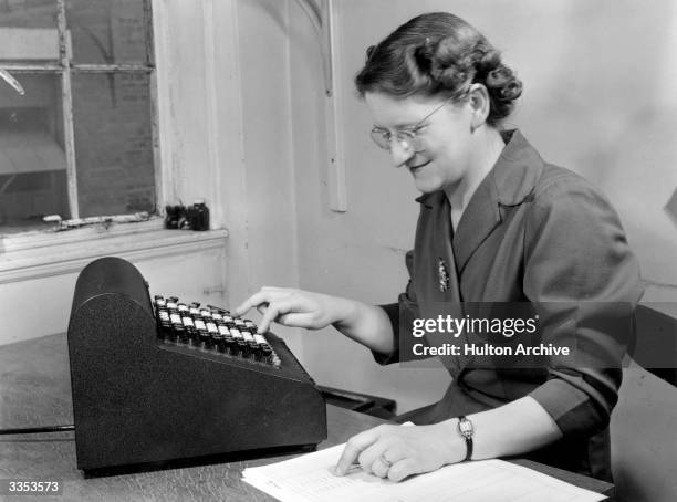 Woman Using A Adding Machine 1,053 Adding Calculator Stock Photos, High-Res Pictures, and Images ...