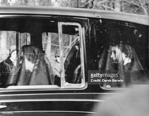 Queen Elizabeth II and Princess Margaret Rose , wearing black veils in the mourning cortege of their late father, King George VI between Sandringham...